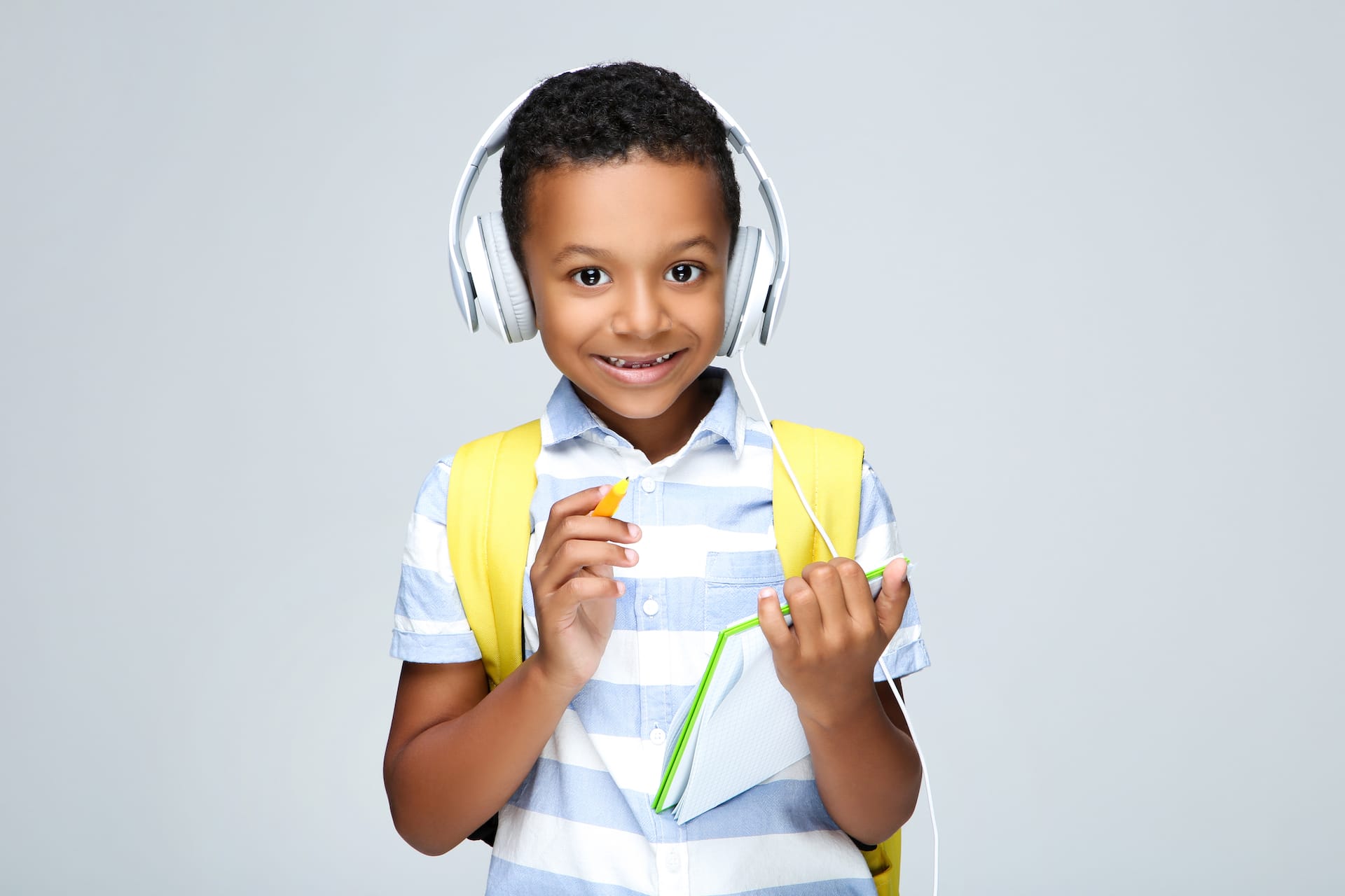 A child wearing noise-reducing head phones.