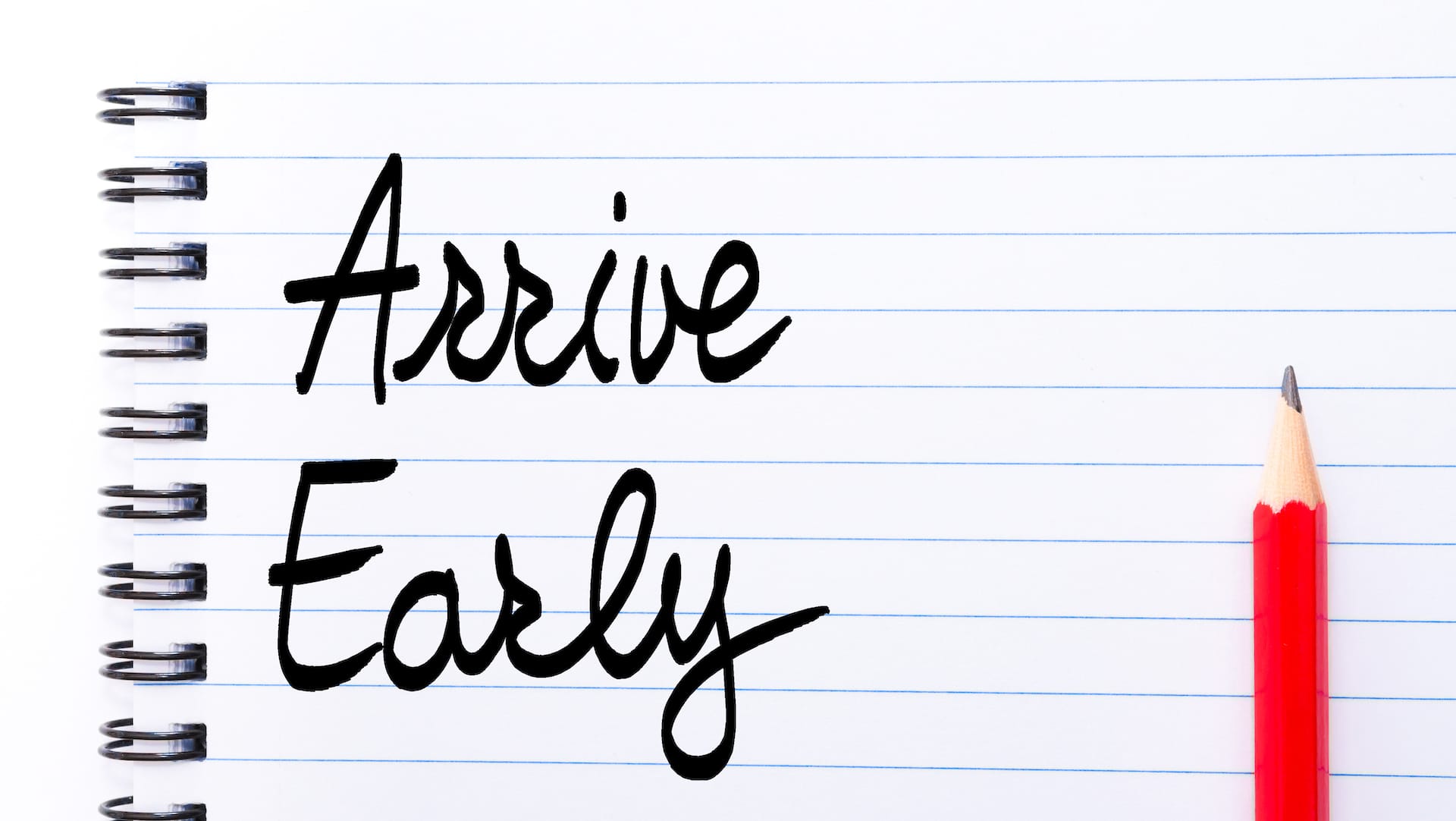 A notebook with text written: "Arrive Early"