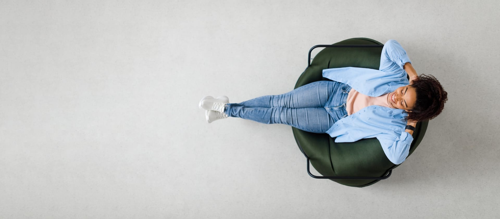 A woman relaxing in a comfortable chair